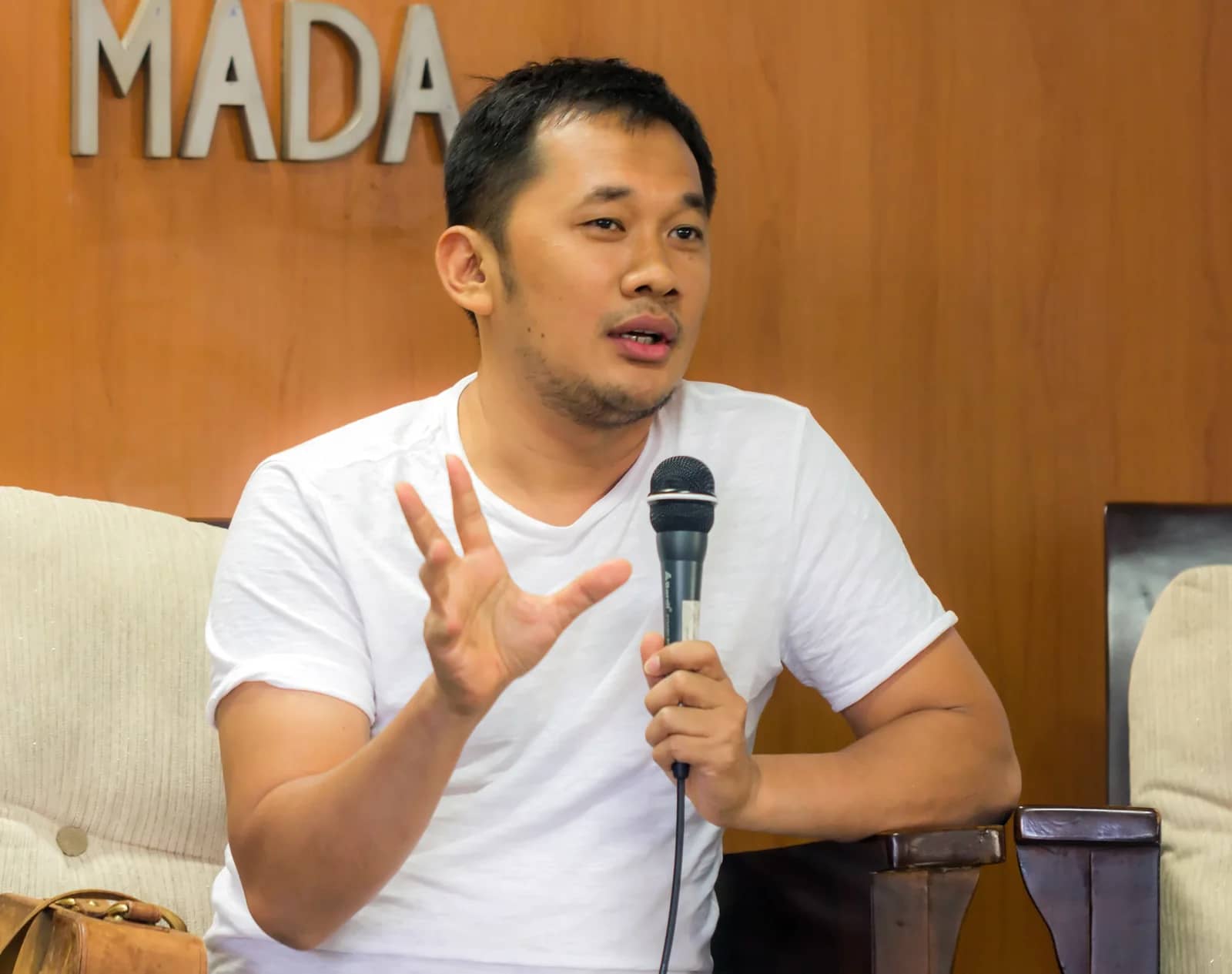 Director Hanung Bramantyo speaking into a microphone at the Jogja-NETPAC Asian Film Festival in 2017