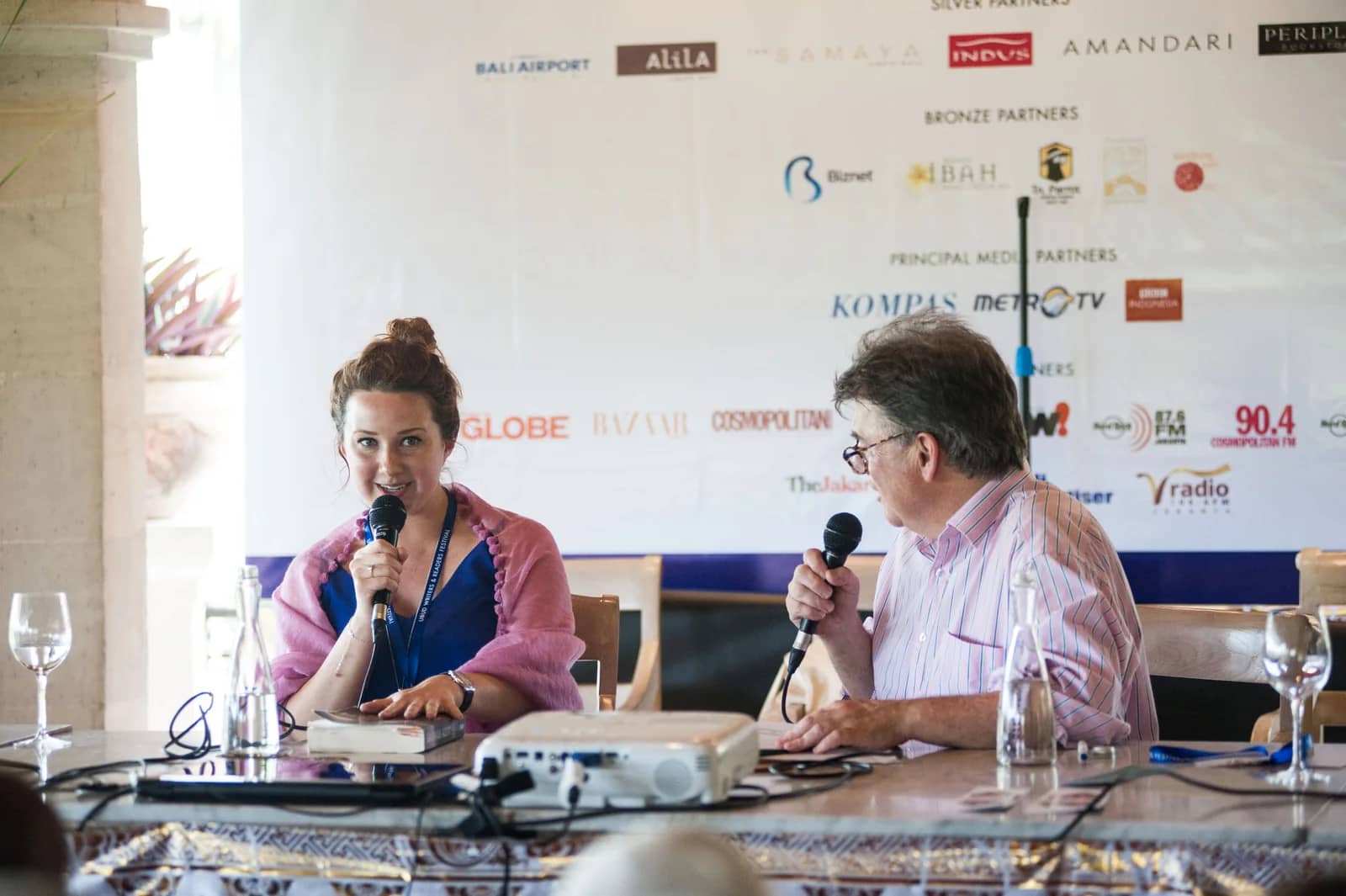 Hannah Kent and a conversation partner seated with microphones at the Ubud Writers & Readers Festival in 2016