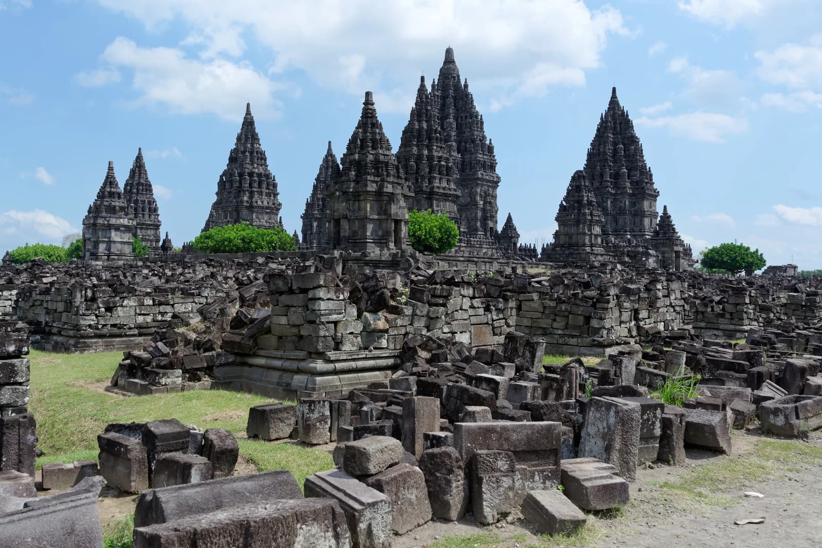 Prambanan temple towers and stone remains of smaller structures