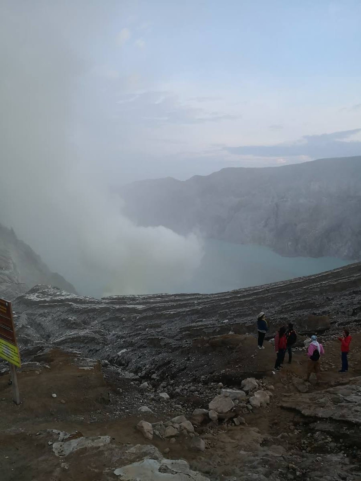 Sulphur miners carrying baskets near the Kawah Ijen crater before dawn